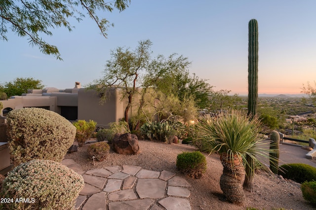 view of patio terrace at dusk