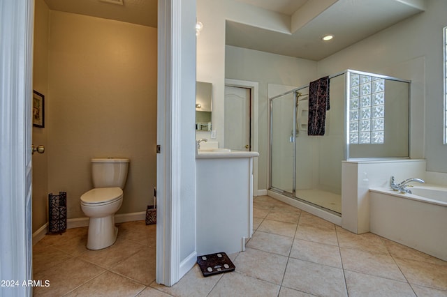 full bathroom featuring tile patterned flooring, independent shower and bath, sink, and toilet