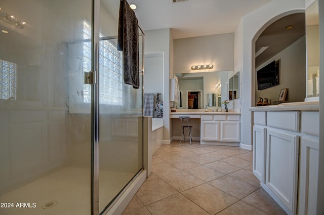 bathroom with vanity, independent shower and bath, and tile patterned flooring