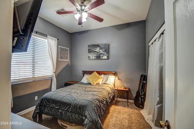 carpeted bedroom featuring ceiling fan