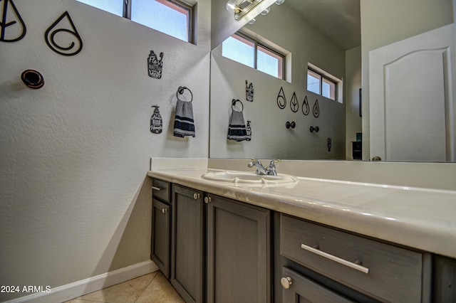 bathroom with tile patterned flooring and vanity