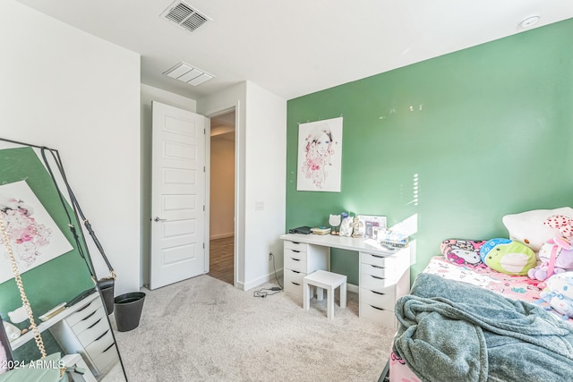 bedroom featuring light carpet