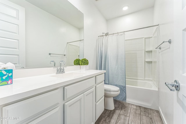 full bathroom with toilet, vanity, hardwood / wood-style flooring, and shower / bath combo with shower curtain