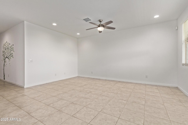 empty room with baseboards, visible vents, a ceiling fan, and recessed lighting