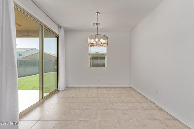 spare room featuring a chandelier, visible vents, baseboards, and light tile patterned floors