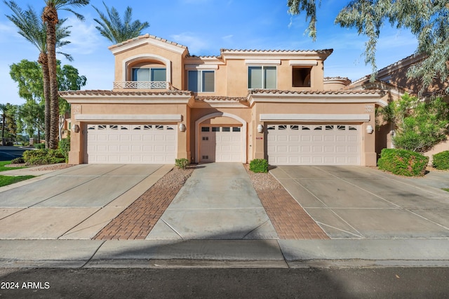 mediterranean / spanish-style home featuring a garage