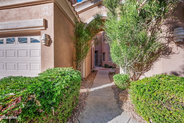 view of exterior entry featuring a garage