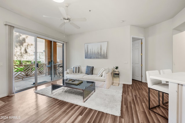 living room featuring hardwood / wood-style flooring and ceiling fan