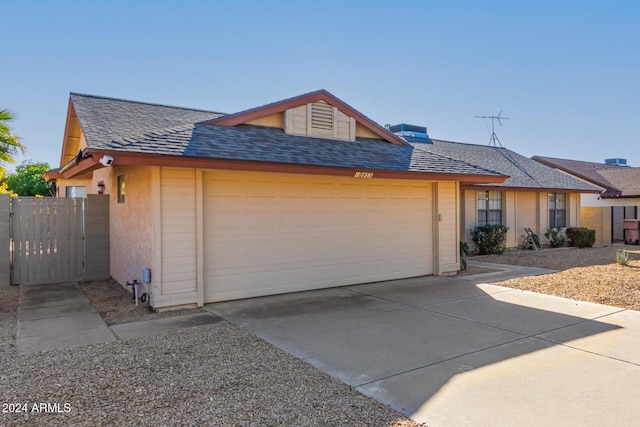 ranch-style home featuring a garage