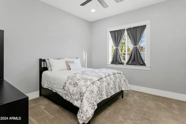 carpeted bedroom with ceiling fan