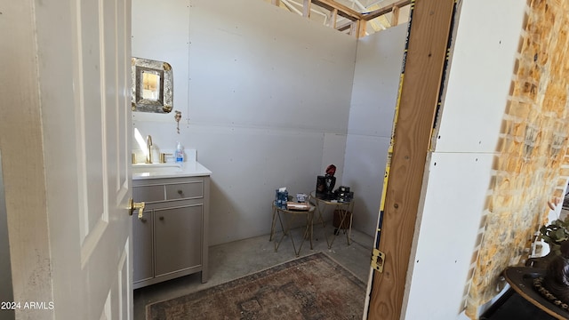 bathroom featuring vanity and concrete floors