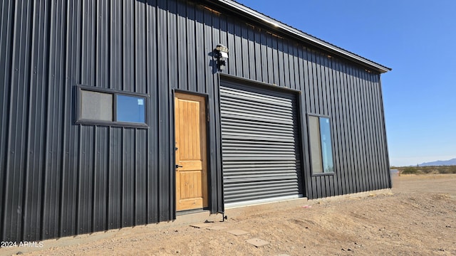 view of home's exterior featuring an outbuilding