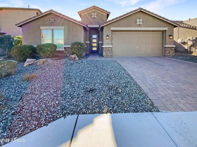 view of front of property with a garage