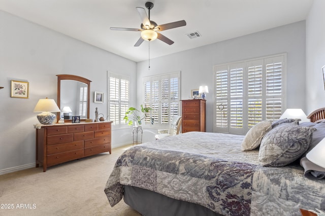 bedroom with visible vents, ceiling fan, light carpet, and baseboards