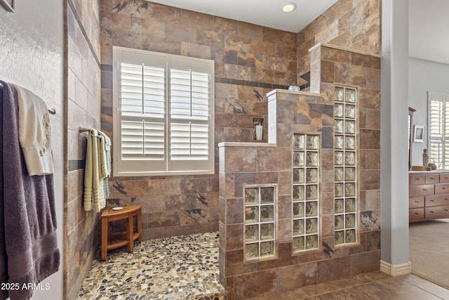 bathroom featuring tile patterned floors and a walk in shower