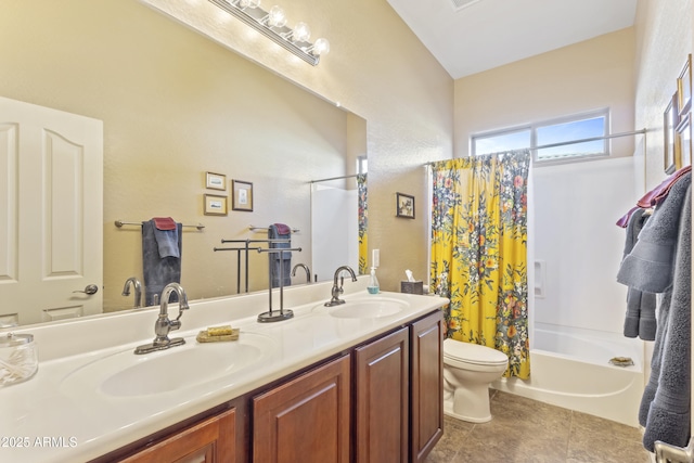 bathroom featuring toilet, shower / bath combination with curtain, double vanity, and a sink