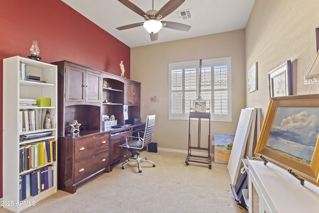 home office with light carpet, ceiling fan, visible vents, and baseboards