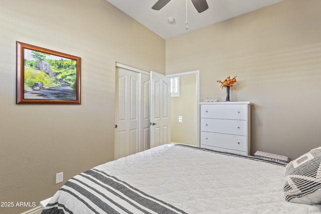 bedroom with a ceiling fan and a closet