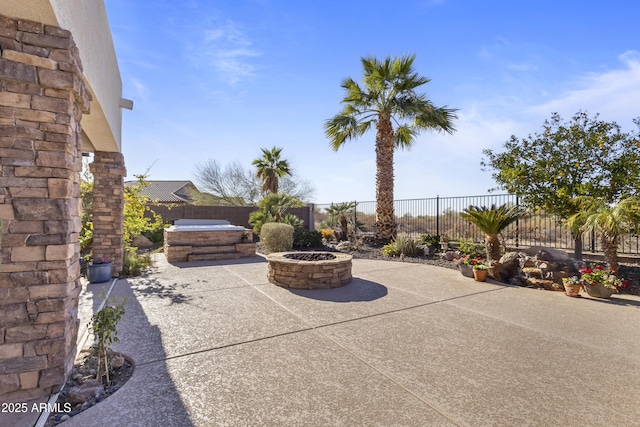 view of patio / terrace with an outdoor fire pit and a fenced backyard