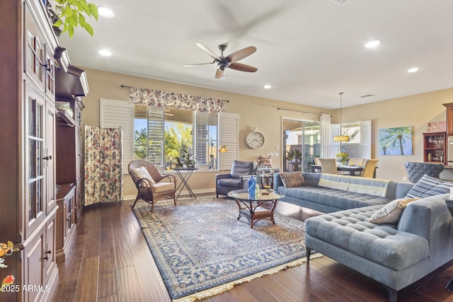 living room with dark wood-style floors, baseboards, a ceiling fan, and recessed lighting