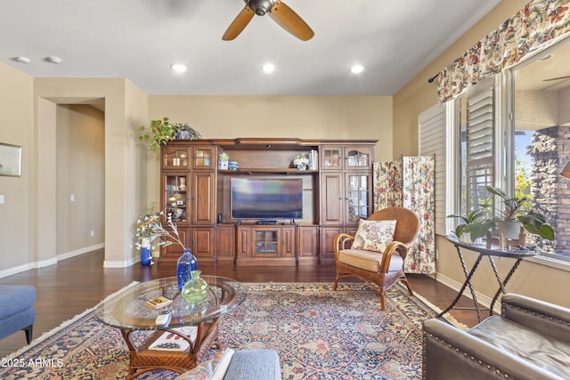 living room featuring dark wood-style flooring, recessed lighting, a ceiling fan, and baseboards