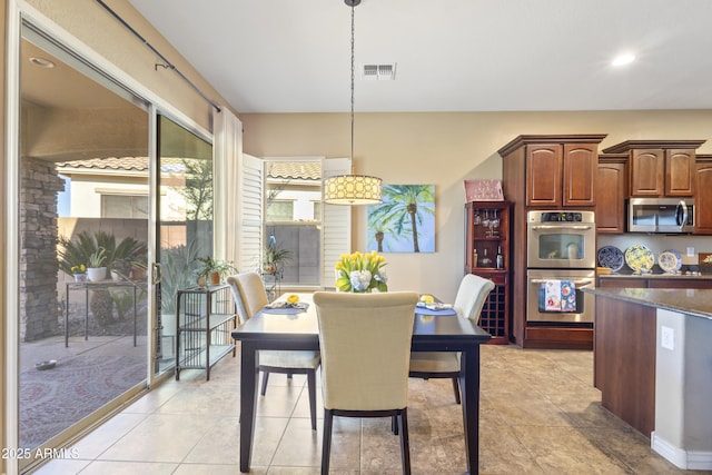 dining room with recessed lighting, visible vents, and light tile patterned flooring