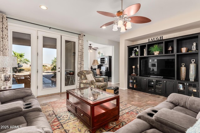 living area with ceiling fan, stone finish floor, french doors, and recessed lighting