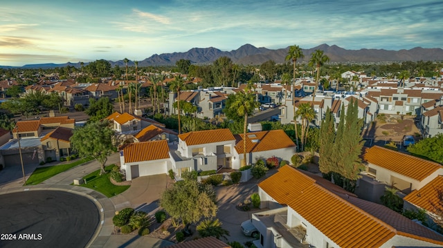 birds eye view of property with a mountain view