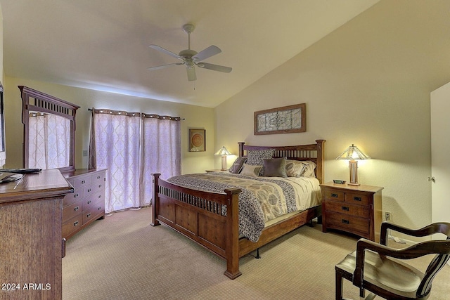 bedroom featuring ceiling fan, lofted ceiling, and light carpet