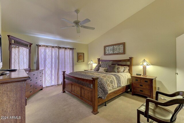 bedroom featuring a high ceiling, connected bathroom, light carpet, and ceiling fan