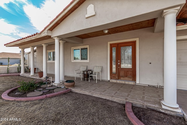 doorway to property with a porch