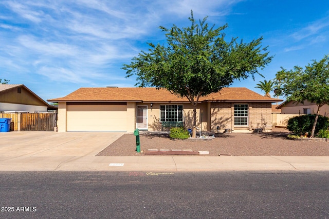 12241 N 49th Ave, Glendale, AZ 85304 - ranch-style house featuring an attached garage, concrete driveway, and stucco siding