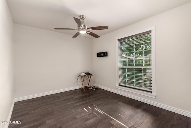 12241 N 49th Ave, Glendale, AZ 85304 - empty room with dark wood-type flooring and baseboards