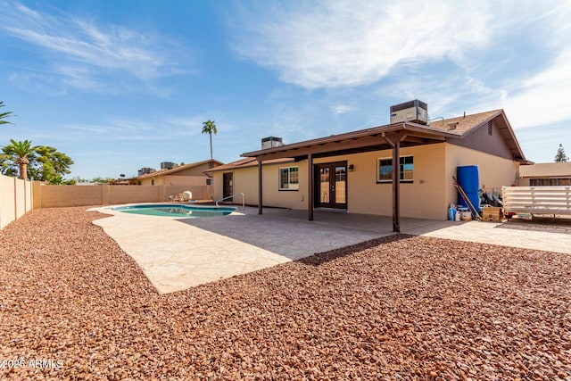 12241 N 49th Ave, Glendale, AZ 85304 - rear view of property featuring french doors, a fenced backyard, a patio, and stucco siding