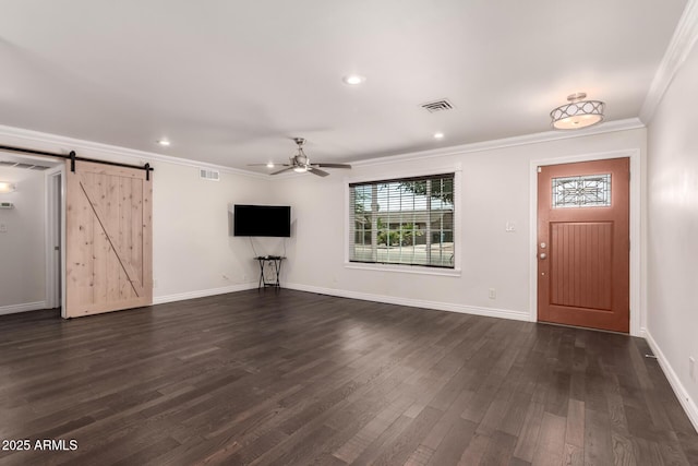 12241 N 49th Ave, Glendale, AZ 85304 - entrance foyer featuring a ceiling fan, a barn door, crown molding, dark wood-style flooring, and baseboards