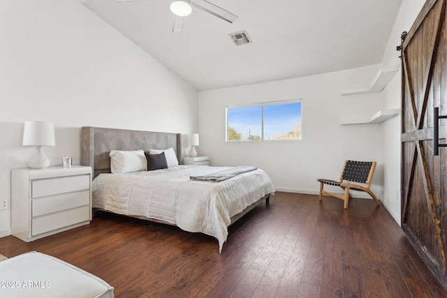 7931 W Shaw Butte Dr, Peoria, AZ 85345 - bedroom featuring visible vents, dark wood-type flooring, a barn door, baseboards, and vaulted ceiling
