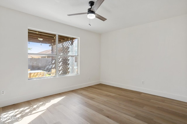 7931 W Shaw Butte Dr, Peoria, AZ 85345 - empty room featuring wood finished floors, baseboards, and ceiling fan
