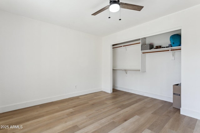7931 W Shaw Butte Dr, Peoria, AZ 85345 - unfurnished bedroom with a closet, baseboards, light wood finished floors, and ceiling fan