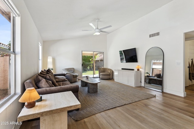 7931 W Shaw Butte Dr, Peoria, AZ 85345 - living room with ceiling fan, visible vents, high vaulted ceiling, and wood finished floors
