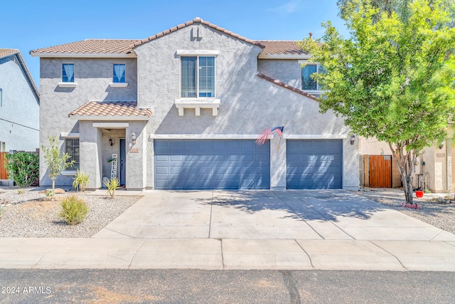 mediterranean / spanish-style home featuring a garage