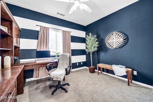 carpeted home office with ceiling fan