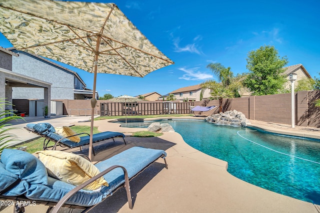 view of swimming pool featuring a patio area