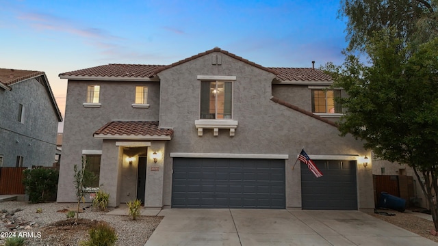 mediterranean / spanish house featuring a garage