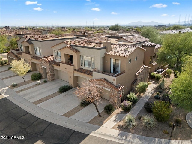 birds eye view of property featuring a mountain view