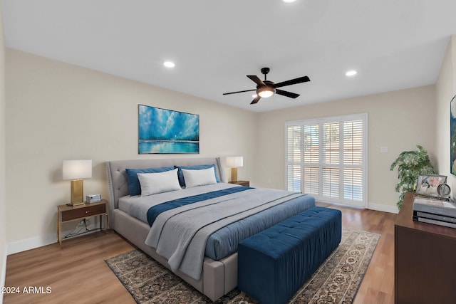 bedroom with hardwood / wood-style flooring and ceiling fan