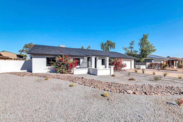 ranch-style home featuring a garage