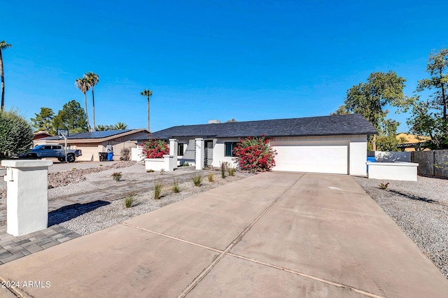 ranch-style home with a garage