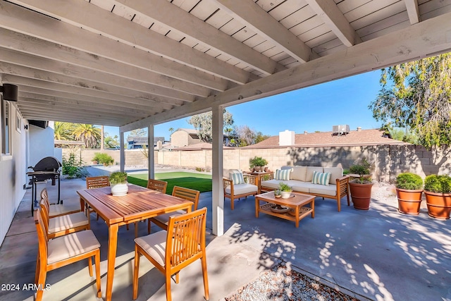 view of patio with a grill and outdoor lounge area