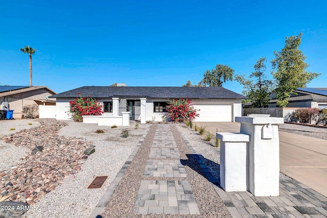 single story home with a garage