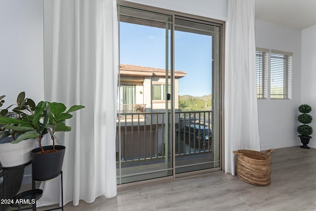 doorway to outside featuring light hardwood / wood-style floors